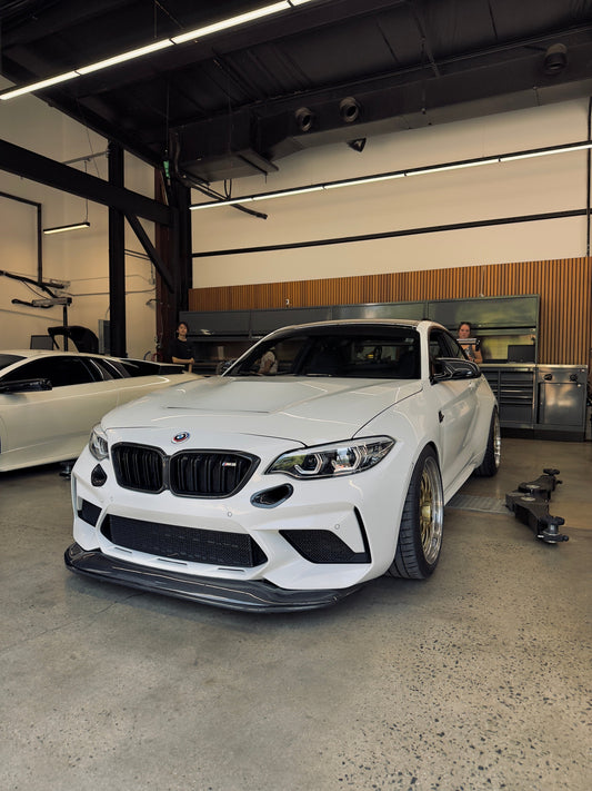 Ridgeline Motorsport chassis-mounted GTS splitter on a BMW F87 M2